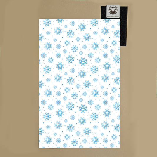 White Next Level Sheet Acrylic with blue snowflake pattern on a brown background