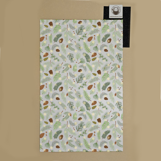Patterned paper with nature-themed design on a beige background