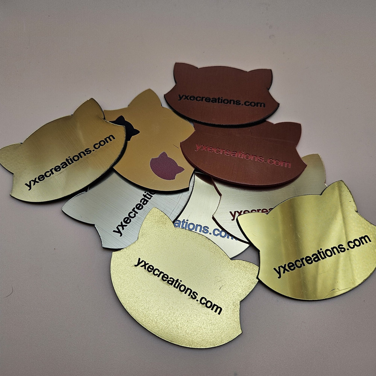 Gold two-tone engravable acrylic samples in brushed, matte and light gold