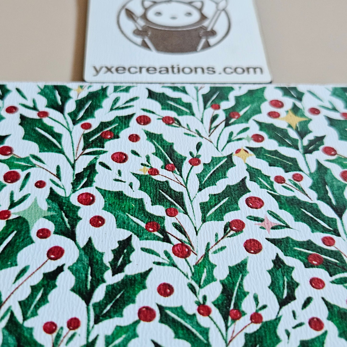 Next Level Sheet Acrylic Holly leaf and berry pattern with a visible brand logo on the side.