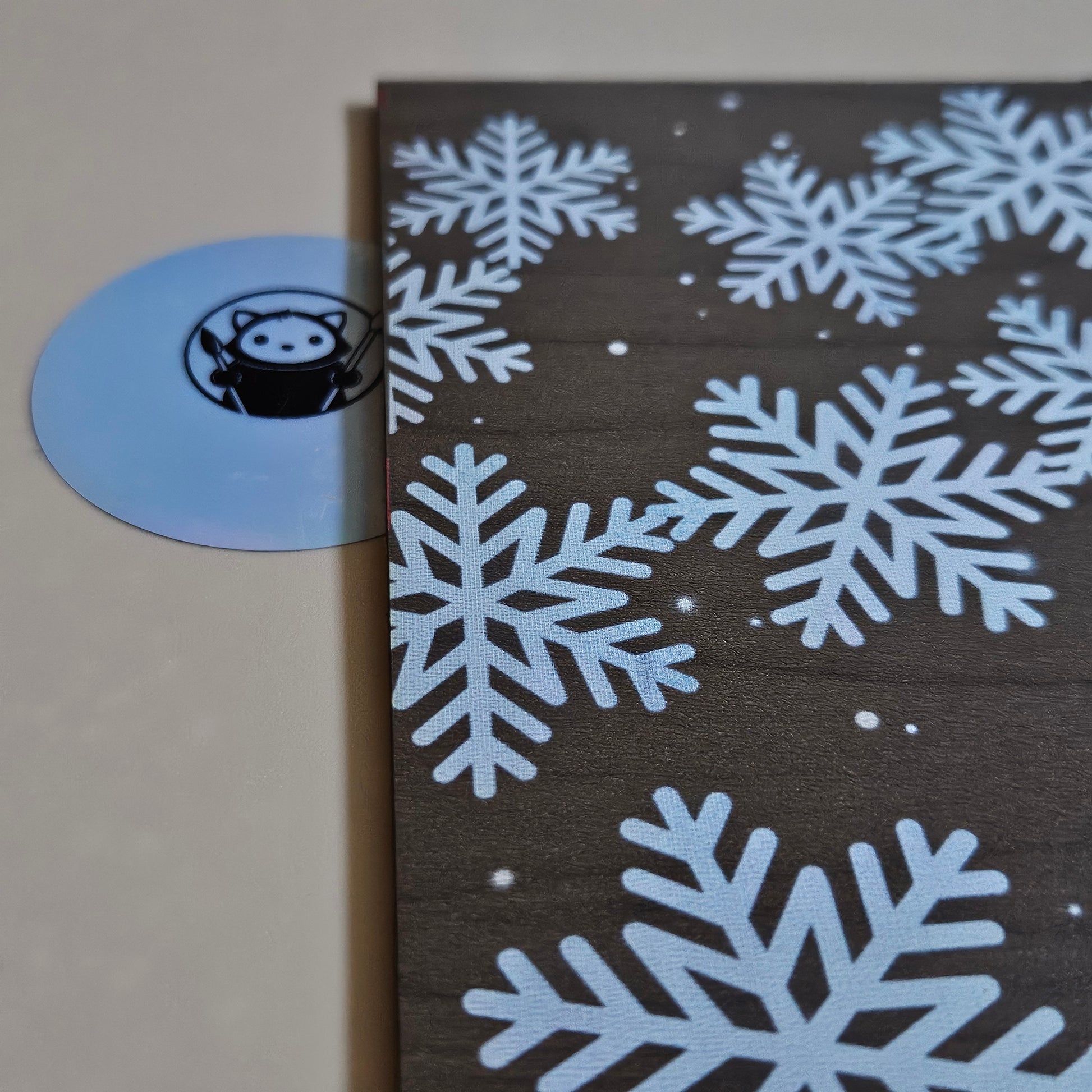 Next Level Sheet Acrylic with blue snowflakes on a brown background