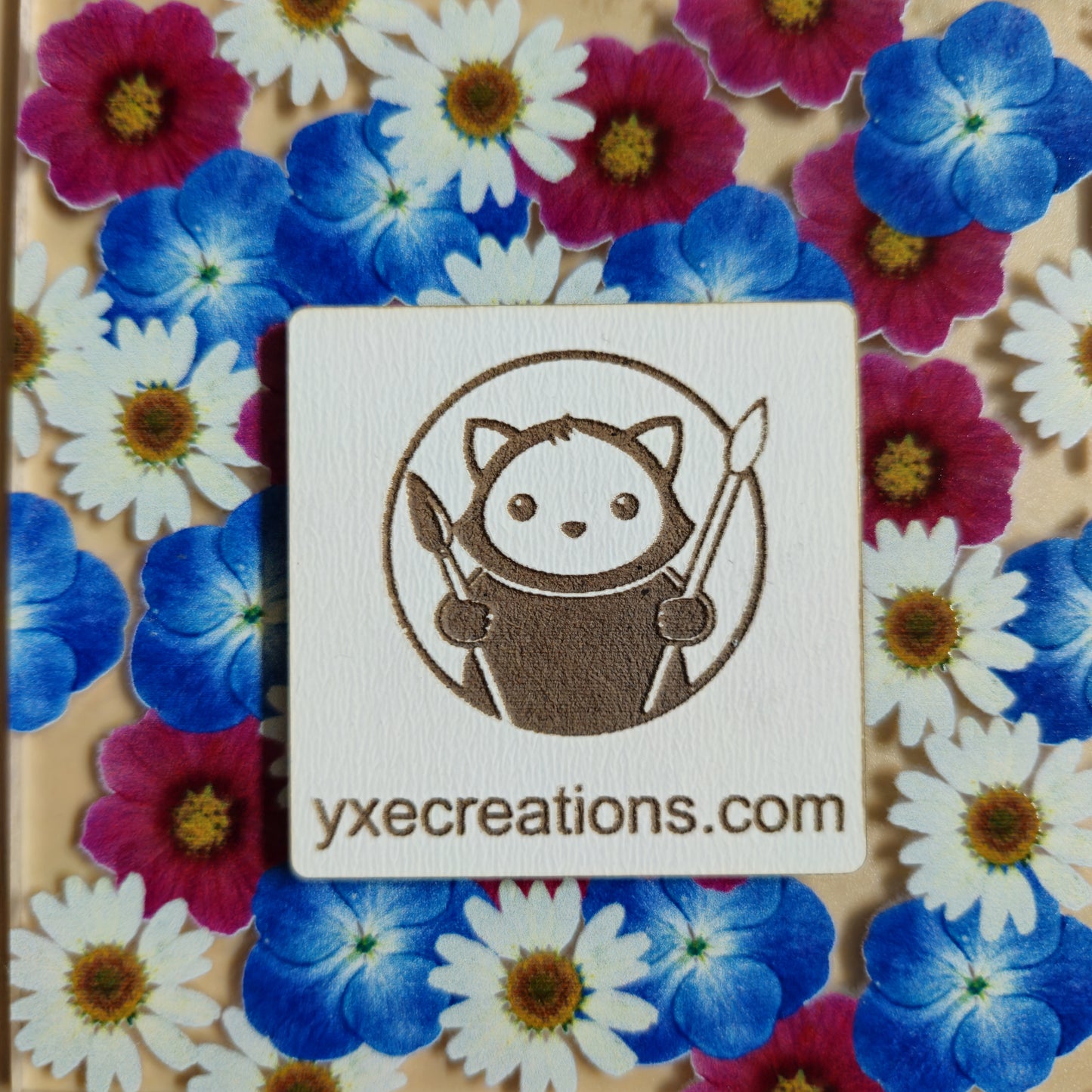 Floral patterned sheet for laser cutting with Wildflower Garden Preview on a beige background with a brand label Next Level Sheet Closeup