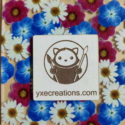 Floral patterned sheet for laser cutting with Wildflower Garden Preview on a beige background with a brand label Next Level Sheet Closeup