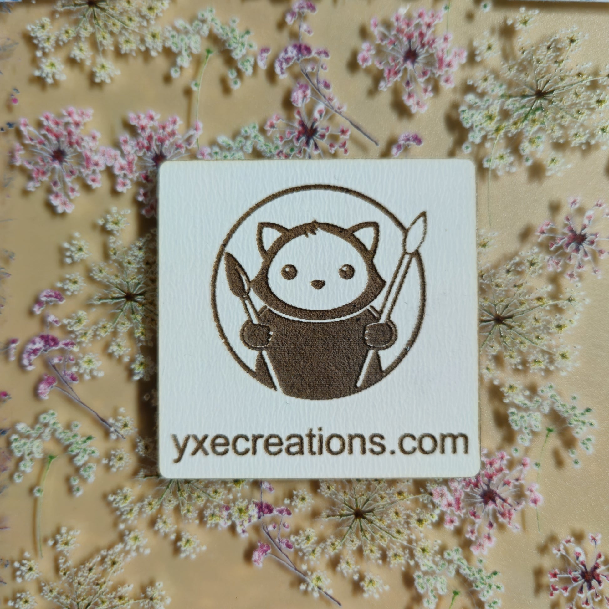 Floral patterned sheet for laser cutting with Wildflower Garden Preview on a beige background with a brand label Next Level Sheet Close UP