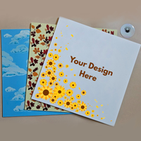 Three customizable acrylic sheets with different designs on a brown background.