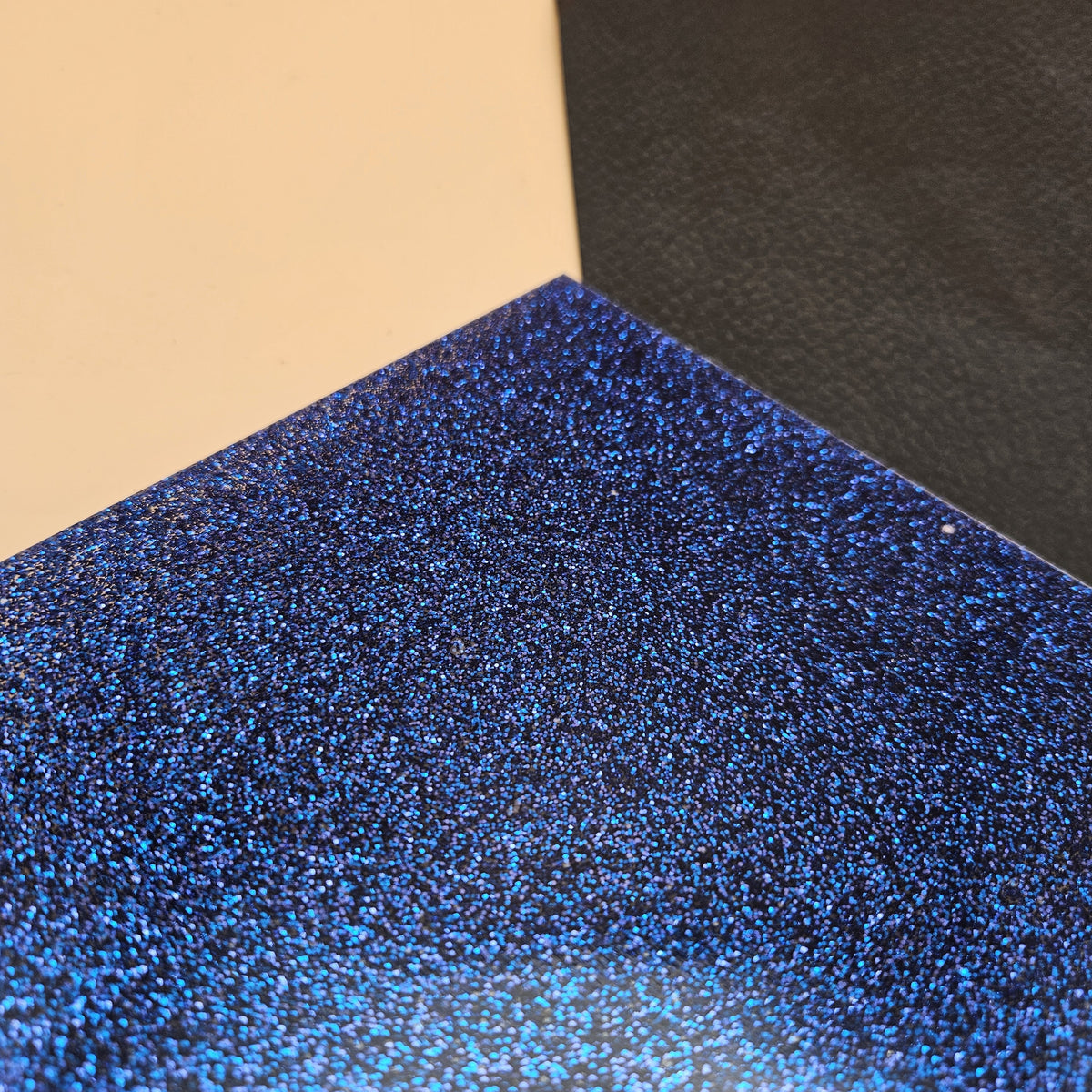 Royal Blue glitter acrylic sheet, angled close-up