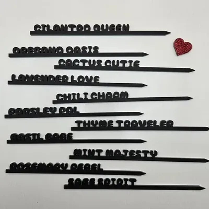 Laser-cut acrylic plant stakes with names made with MyLaserTools