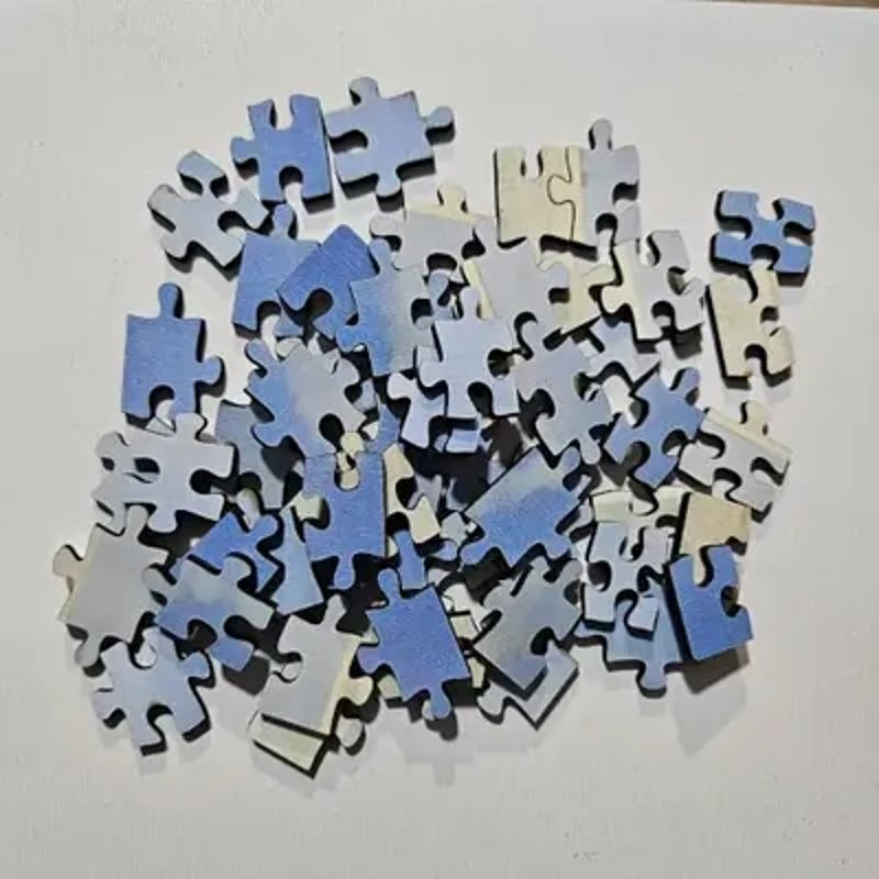 Laser-cut jigsaw puzzle pieces made with MyLaserTools