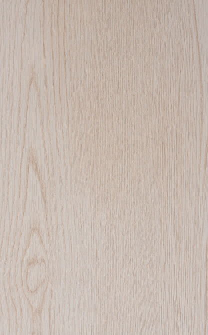 Close-up of a light wood texture with visible grain.