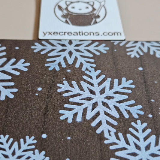 Brown Next Level Sheet Acrylic with white snowflake pattern and VYCE Creations logo.